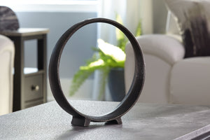  this sculpture rounds out your decor in sleek style. The black finish has an edgy appeal that remains versatile