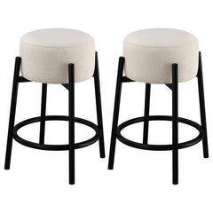 Casual with sleek lines, slide this pair of contemporary stools up to a bar or kitchen breakfast area. Designed with a thick pouf-like cushion wrapped in a white upholstery, this stool lends an elegant playful charm to any space. The pouf-inspired seat re