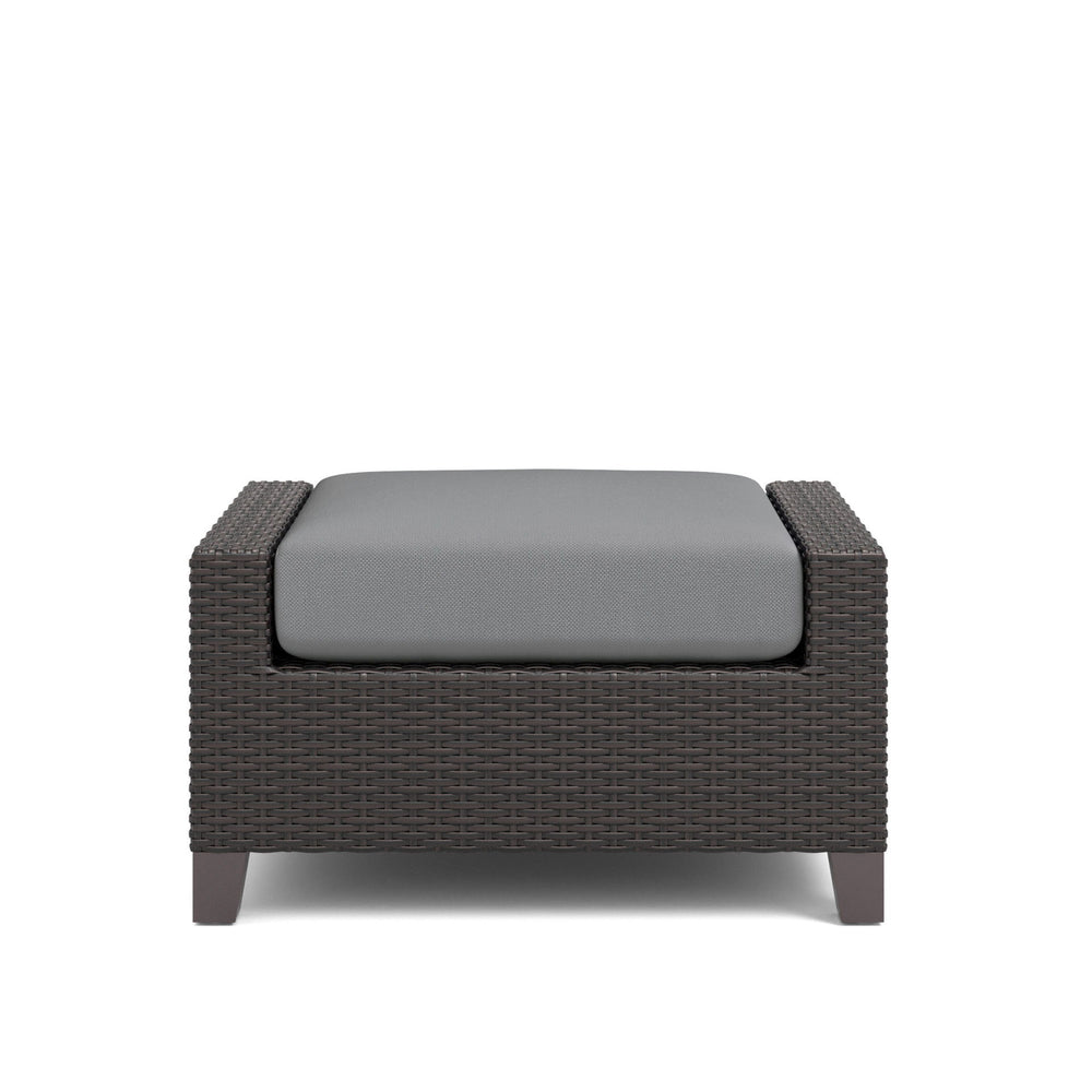 The Skye Outdoor Ottoman Set in Gray includes 2 cushioned ottomans and is crafted with durable aluminum frames and a baked-on powder finish to ensure longevity and scratch resistance. The high-density HDPE wicker mimics the look of natural wicker while be