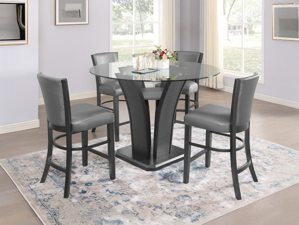 This sleek and modern counter height dining group bridges form and function. The sculptural dining table has a sturdy base and the glass top allows views of the upholstered open shelf. Streamlined chairs feature pewter finished wood and dark gray upholste