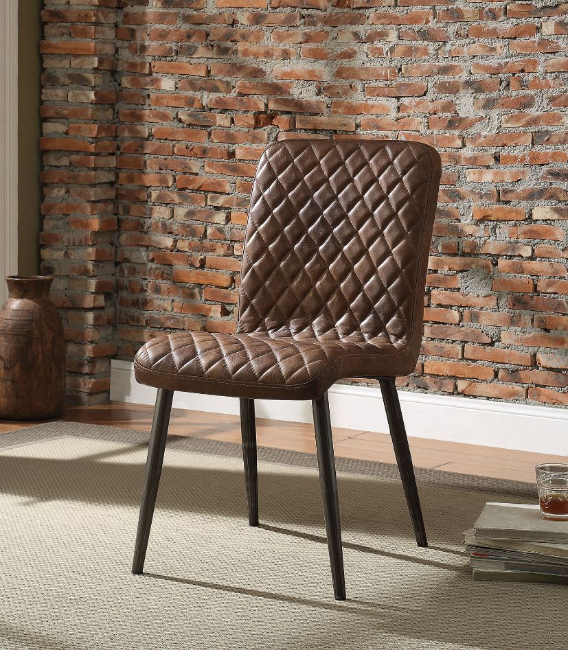 The Millerton side chair bring a clean and modern style to your dining room. This dining chair features a diamond patterned brown top grain leather padded seat with metal tapered legs in an antique black finish, creating a retro vibe. Add this chair to an