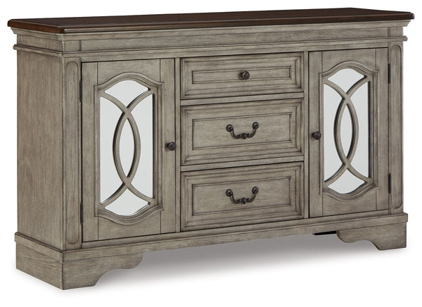 Serve up a sense of traditional cottage design with this dining room server. It features a pair of cabinet doors with inset mirrored glass and decorative fretwork. The server-'s three smooth-gliding drawers with dovetail construction and black felt bottom