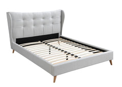 Every element from the wing back styled headboard, light gray upholstery, and button tufting exudes timeless elegance and contemporary comfort. The fully upholstered bed features a distinct and sophisticated headboard designed with wing back and button tu