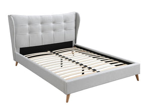 Every element from the wing back styled headboard, light gray upholstery, and button tufting exudes timeless elegance and contemporary comfort. The fully upholstered bed features a distinct and sophisticated headboard designed with wing back and button tu