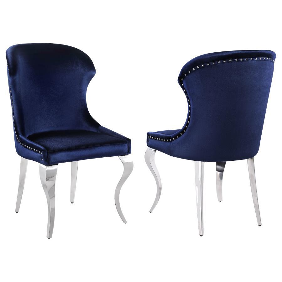 Indulge in the ultimate dining experience with the demi wing dining side chair. Its polished stainless steel cabriole legs exude sophistication, while the individually hand-driven nailhead trim adds a luxurious touch. Wrapped in soft velvet upholstery, th