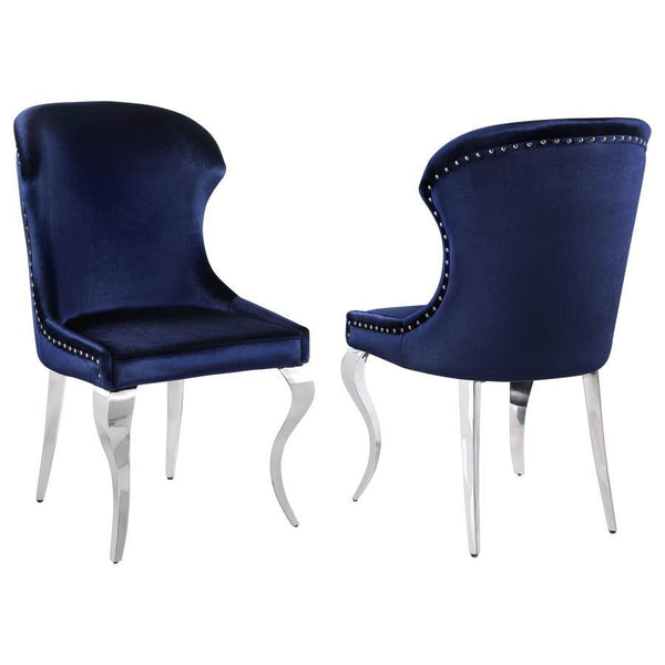 Indulge in the ultimate dining experience with the demi wing dining side chair. Its polished stainless steel cabriole legs exude sophistication, while the individually hand-driven nailhead trim adds a luxurious touch. Wrapped in soft velvet upholstery, th