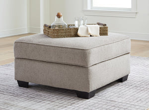 with concealed storage and cup holders beneath the removable cushioned top. With soft upholstery and a generous scale