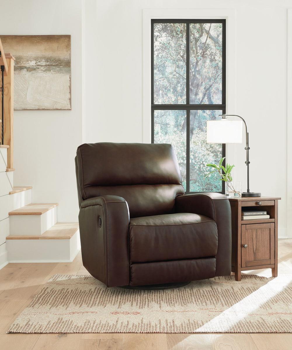 Embrace streamlined design. The sleek form of this swivel glider recliner is rich in tailored function. Its reclining, swivel and gentle rocking motions relax you in refined style. And the expertly matched leather and faux leather upholstery, in a deep ne
