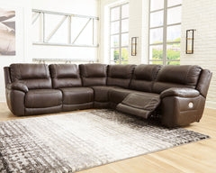 Load up on comfort in a cool, clean-lined and contemporary way with the Dunleith power reclining sectional in chocolate brown. Rest assured, the leather match upholstery is enriched with a pebble grain effect for authentic appeal and enhanced with jumbo s
