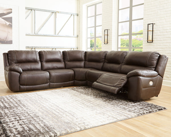 Load up on comfort in a cool, clean-lined and contemporary way with the Dunleith power reclining sectional in chocolate brown. Rest assured, the leather match upholstery is enriched with a pebble grain effect for authentic appeal and enhanced with jumbo s