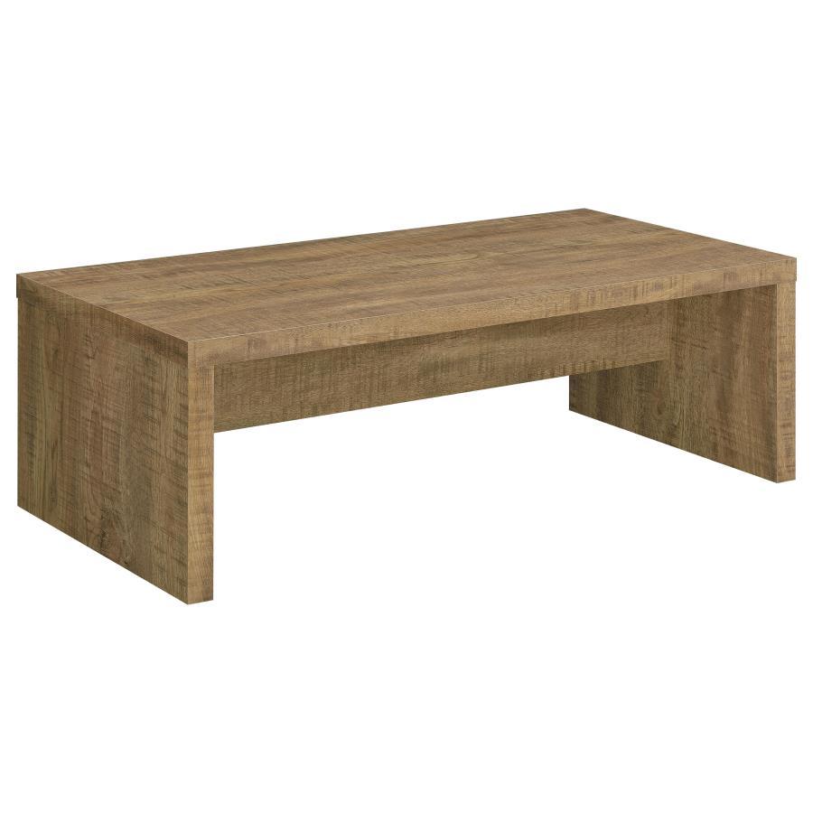 Rustic simplicity infuses a farmhouse coffee table with welcoming character. Charming in your living room, it-'s a clean silhouette with the look of roughhewn mango wood in a melamine paper finish. The rectangular table offers two solid sides and a center