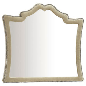 This stately mirror will bring a sense of French Provincial design into your sleeping space. Ideal for pairing with a matching dresser, this is an upholstered mirror with exceptional aesthetic details. A row of nailhead trim adds a textured element to the