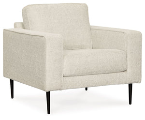  the slim-profiled piece welcomes you with its cozy character. A subtle chevron pattern on the cushions refreshes the classic neutral hue