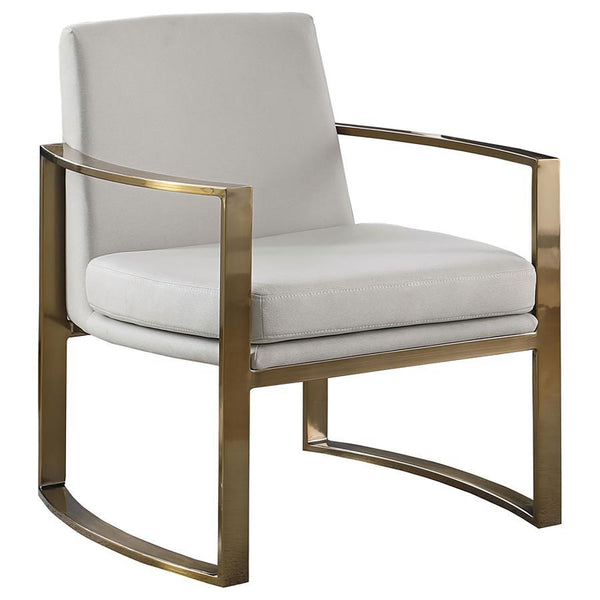 Strikingly modern and pleasing to the eye, this accent chair will perk up your living area. Concave armrests bring a supportive and comfortable seating experience. They boast a brushed bronze finish and add rich curvature to a classic silhouette. Padded c