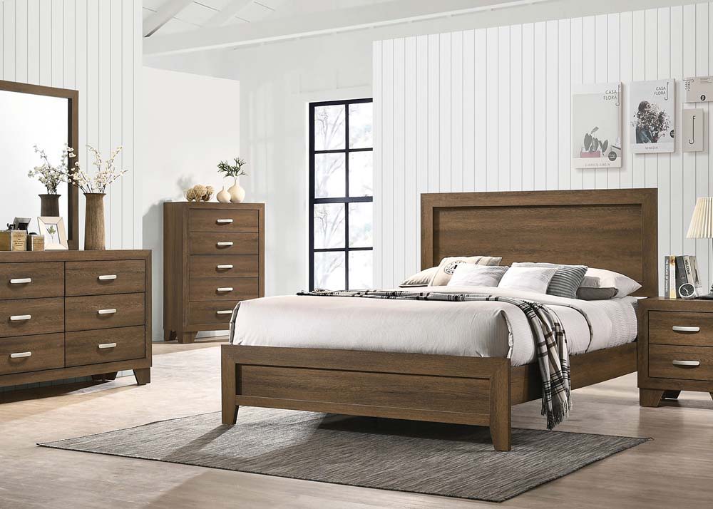 The Miquell bedroom collection provides a commanding presence in any bedroom. This contemporary panel bed features a rectangular headboard with a low profile footboard and tapered legs. All expertly crafted with a transitional look that is an ideal additi