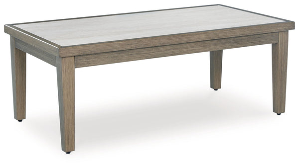 Experience the perfect combination of durability and style with this outdoor coffee table. An aluminum frame with a wood-look finish maintains a sleek, contemporary aesthetic, while the sintered stone tabletop adds an element of natural elegance. This del