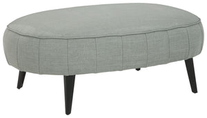 Cool takes a new shape in your living room with this ottoman. Rounding out your stylish, urban space, this piece sports a velvety soft upholstery and sleek, tapered legs. Pop your feet up or use this oversized accent as a center table with a tray placed o