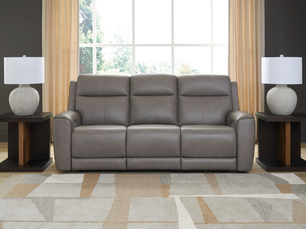 Masterfully blend high style and must-have comfort with this power reclining sofa. Its clean, transitional look is crafted with luxury in mind, complete with supple top-grain leather in the seating area. Eloquently incorporated into the sleek design are f