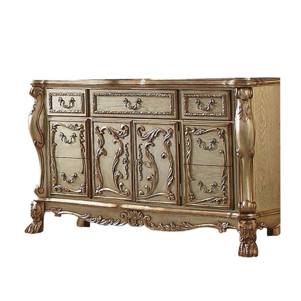 The Dresden dresser/server is a new rendition to a classic style, finished in gold patina with a hint of gold. The antiqued look is further highlighted with hand applied burnish. This dresser/ server features seven Felt-Lined drawers and two doors with de
