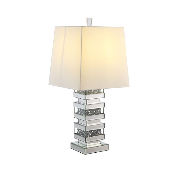  this Noralie Table Lamp will bring a touch of Hollywood glamourous to any room space. Featuring novelty design with mirrored finish and trimmed with clear glass of faux diamond inlayed