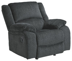 Built for luxury, this rocker recliner lets you kick back in reliable style. The thick, softly textured chenille upholstery provides a comfy surface on which to lounge. With bustle back construction and thickly cushioned armrests, this piece gives you the