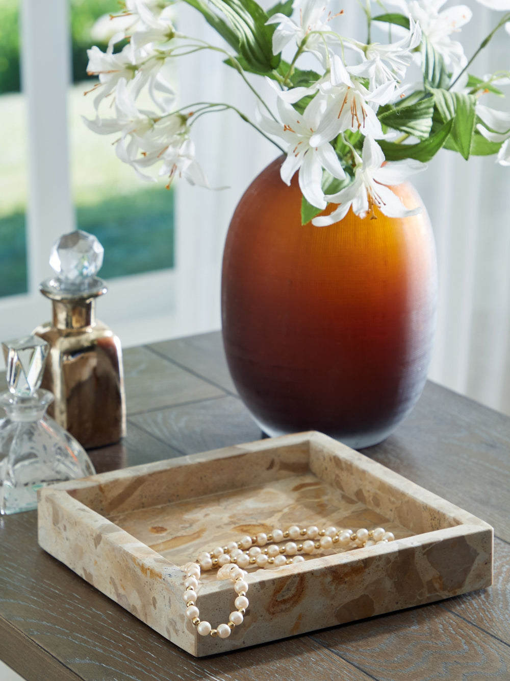 Sleek and sculptural, this marble tray puts a casual contemporary twist on both display and dining. Itâ€™s a luxe host for keys and other essentials on an entryway table, and equally chic when holding small decorative items. Whatâ€™s more: its food-safe d