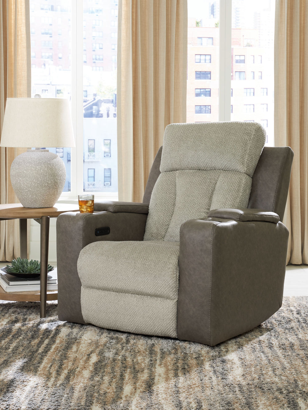 Refined relaxation, reimagined for the modern home. This power recliner combines premium comfort with smart features like built-in storage arms, USB charging and cup holders. One-touch reclining and an adjustable headrest let you find your perfect positio
