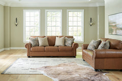 Merging traditional motifs with a modern hue, this living room set ties your transitional seating area together. Classic roll arms decorated with nailhead trim bookend the comfortable cushions for a bit of extra flair. Itâ€™s approachable, yet luxurious. 