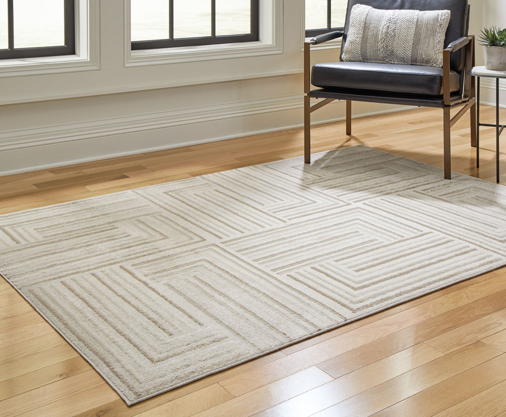 Looking for warmth and coziness in your home? This area rug is the ideal solution. With its high-low pile and neutral-hued geometric design, it seamlessly blends with both modern and traditional decor styles. Experience the inviting ambiance this rug brin