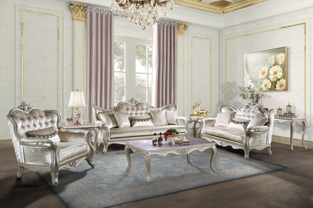 The Monique 3 Piece Royal Classic Living Room Set, featuring a sofa, loveseat, and chair in a luxurious champagne finish, is a testament to heirloom-quality craftsmanship and timeless elegance. Expertly constructed from premium pine solids and adorned wit