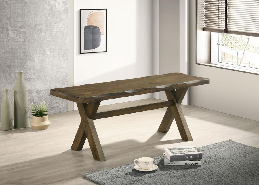 Crafted from solid rubberwood, this dining bench embodies rustic charm with its knotty nutmeg finish and worn edges that highlight the natural beauty of wood. The sturdy trestle-style base provides reliable support, while the smooth, contoured seat offers