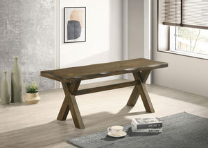  this dining bench embodies rustic charm with its knotty nutmeg finish and worn edges that highlight the natural beauty of wood. The sturdy trestle-style base provides reliable support