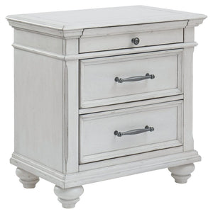 Give your retreat vintage charm and valuable bedside storage with this nightstand. In a beautifully distressed whitewash finish, two drawers and a smaller top accessory drawer will help you keep bedtime essentials nearby in casual style. Generously scaled