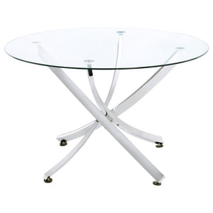 This round dining table offers a striking balance of clarity and form. A clear tempered glass top creates an airy presence, while the sculptural asterisk-style base adds dramatic visual interest. Crafted from heavy gauge metal, the base is electroplated i