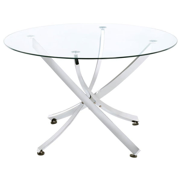 This round dining table offers a striking balance of clarity and form. A clear tempered glass top creates an airy presence, while the sculptural asterisk-style base adds dramatic visual interest. Crafted from heavy gauge metal, the base is electroplated i