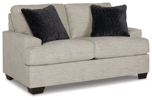 Laid-back luxury meets neutral practicality in this loveseat. Taking its cues from contemporary design, the clean-lined piece is outfitted with angular arms for a layer of geometric expression. Softly upholstered, sizable cushions keep you comfortable, wh