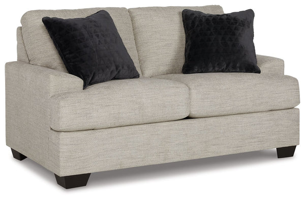 Laid-back luxury meets neutral practicality in this loveseat. Taking its cues from contemporary design, the clean-lined piece is outfitted with angular arms for a layer of geometric expression. Softly upholstered, sizable cushions keep you comfortable, wh