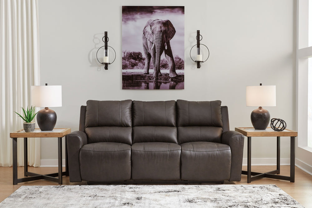 Experience modern luxury with this power reclining sofa. The soft-to-the-touch leather and faux leather upholstery brings ultimate relaxation at a price you can afford. With sleek arms and a plush, pillowy back, the sofa merges comfort and support with a 