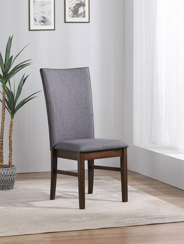  making it the perfect complement to any dining table. Upholstered in soft gray fabric on both sides of the backrest and the seat