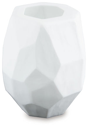  faceted look of the hand-carved surface and makes each piece one