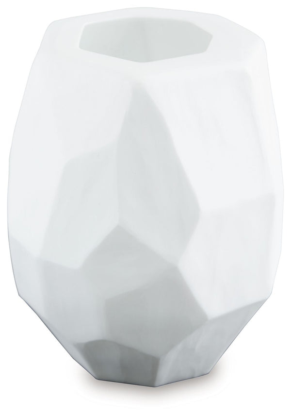  faceted look of the hand-carved surface and makes each piece one