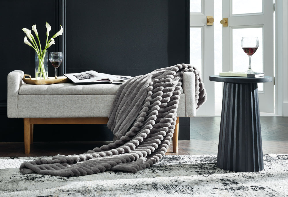As cozy as they come, this faux fur throw turns your seating area into a haven of comfort. Its neutral hue acts as the perfect foundation for layering, whether mixed with pillows or draped over the arm of a sofa. And itâ€™s machine washable, so you can sp