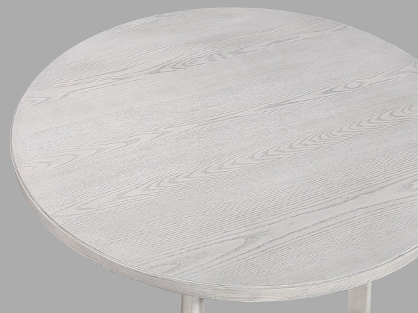  designed for both casual meals and lively gatherings. The round tabletop features a charming weathered finish