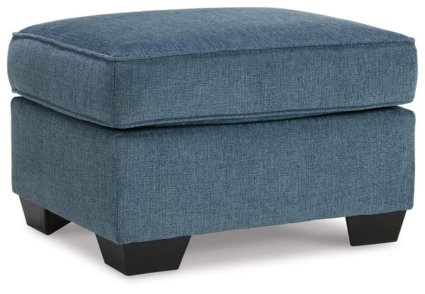 Need a simple style refresh? Liven up your living room essentials with this ottoman. A chunky silhouette holds inviting cushioning perfect for propping up feet or a decorative tray. Crosshatched upholstery gives the otherwise casual design a delightful vi