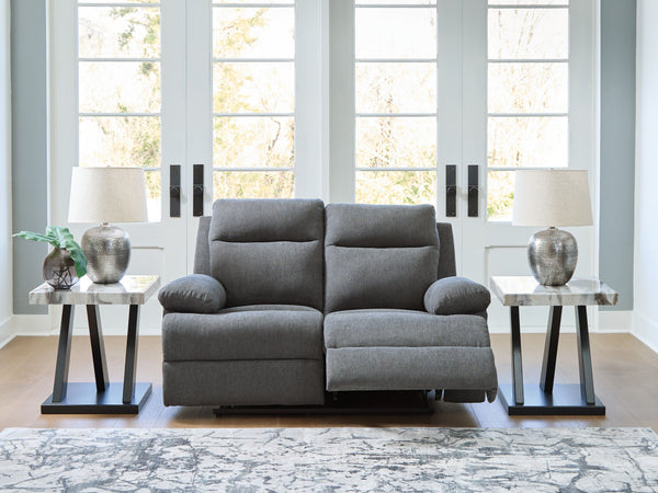  this traditional-inspired reclining loveseat caters to the art of relaxation. Super soft charcoal-colored upholstery and sumptuous cushioningâ€”made all the more indulgent with pillow top armsâ€”cradles you in co