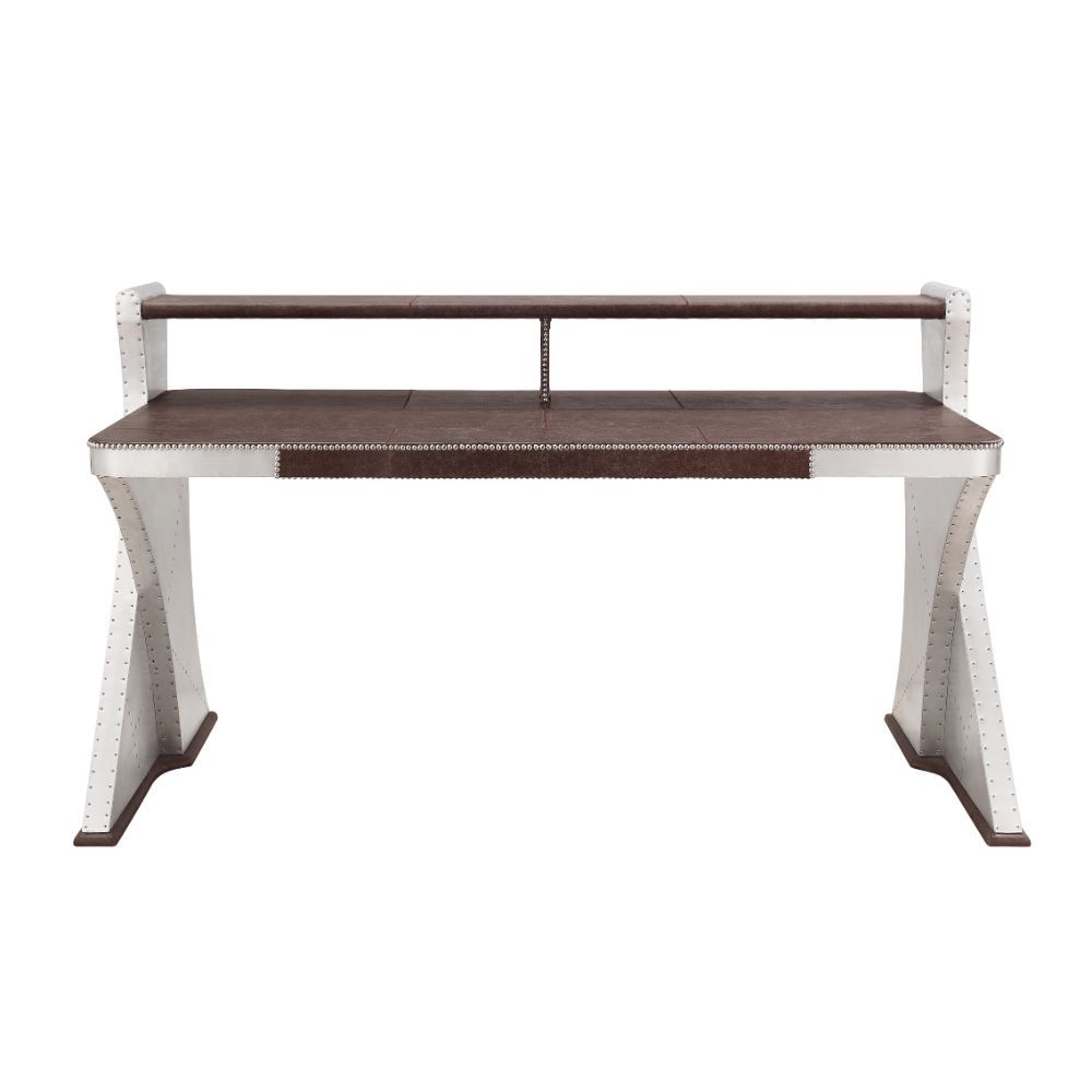 The Brancaster Aluminum Desk-'s modern look and industrial styling include retro brown top grain leather top, aluminum over plywood construction, and exposed rivets that form a patchwork over the frame. A brilliant addition to your workspace, this desk fe