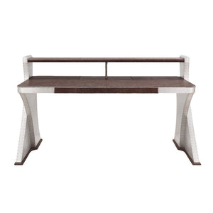 The Brancaster Aluminum Desk-'s modern look and industrial styling include retro brown top grain leather top, aluminum over plywood construction, and exposed rivets that form a patchwork over the frame. A brilliant addition to your workspace, this desk fe