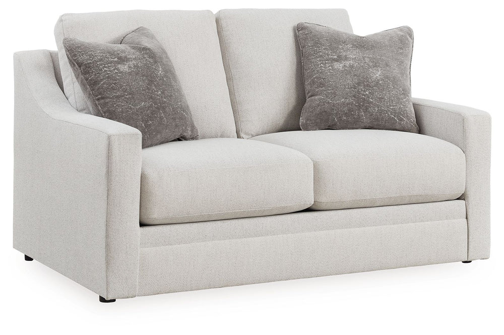 Clean lines and a streamlined silhouette define the architectural attitude of this loveseat. Textured accent pillows in complementary colors add subtle contrast. The loveseat-'s plush reversible cushions beckon you to sit down, get comfy and relax complet