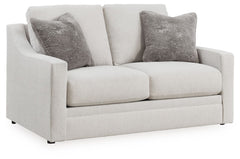 Clean lines and a streamlined silhouette define the architectural attitude of this loveseat. Textured accent pillows in complementary colors add subtle contrast. The loveseat-'s plush reversible cushions beckon you to sit down, get comfy and relax complet