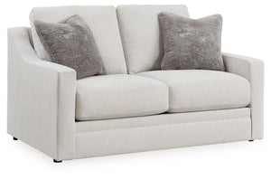 Clean lines and a streamlined silhouette define the architectural attitude of this loveseat. Textured accent pillows in complementary colors add subtle contrast. The loveseat-'s plush reversible cushions beckon you to sit down, get comfy and relax complet